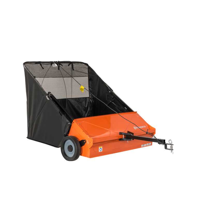 Tow-behind sweeper/collector for efficient collection of clippings. Adjustable height setting. Can be emptied from operator's seat.